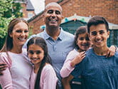 A family smiles for a portrait