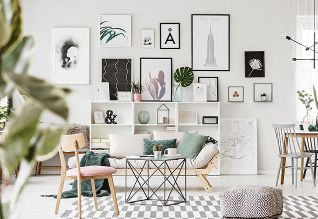 A modern living room with modern art on the far wall