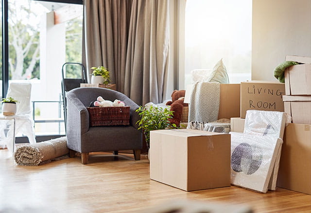 Boxes and household items wait to be packed away for a move