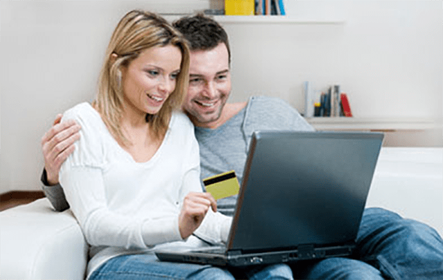 Couple browsing on a laptop computer