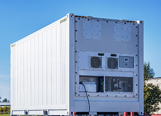 A portable refrigeration container sits in a parking lot