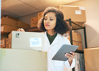 A medical technician takes inventory of stock