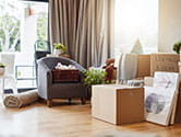 Boxes and household items wait to be packed away for a move