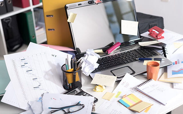 View of a cluttered and messy home office desk