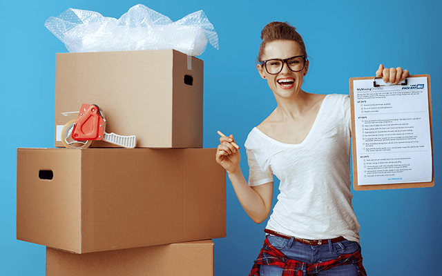 A woman holds a 1-800-PACK-RAT moving checklist in her hand next to some packed boxes