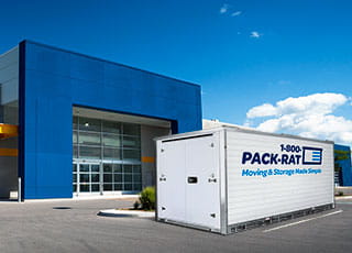 1-800-PACK-RAT portable storage container in front of a store