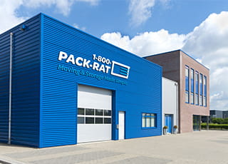 Exterior shot of warehouse with Pack Rat logo