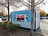 A 1-800-PACK-RAT portable storage container is being used for a Toys for Tots toy drop off location