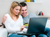 Couple browsing on a laptop computer